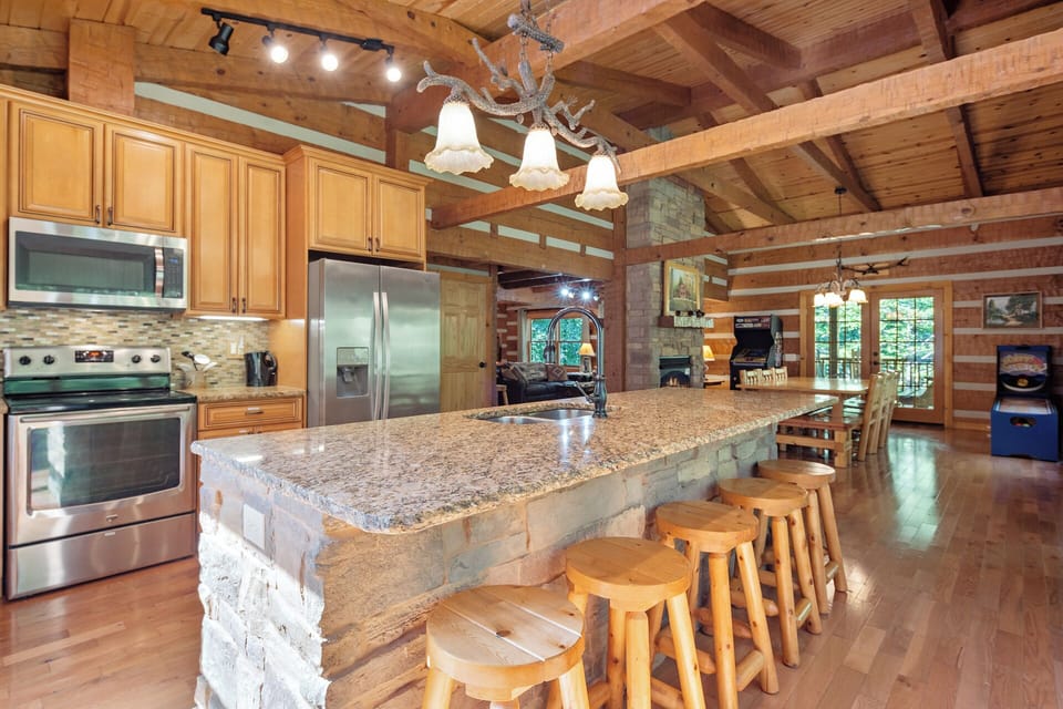 Fully equipped kitchen with everything you need for easy meals during your stay. Kitchen island seating for 6
