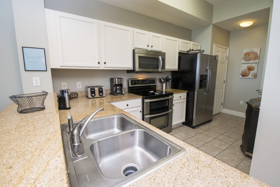 Kitchen with Toaster, Coffee Machine, Dishes and Utensils