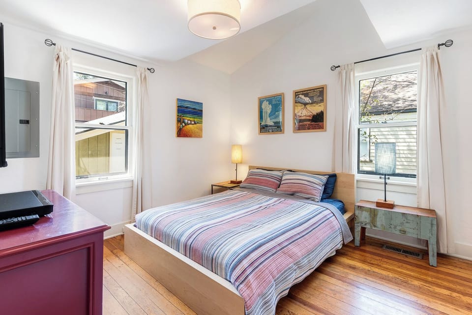 Downstairs large queen bedroom with wall mounted TV and walk in closet