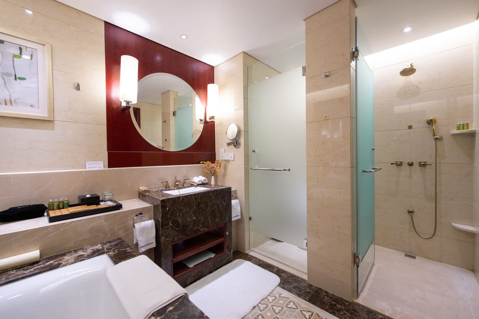Separate tub and shower, free toiletries, hair dryer, slippers