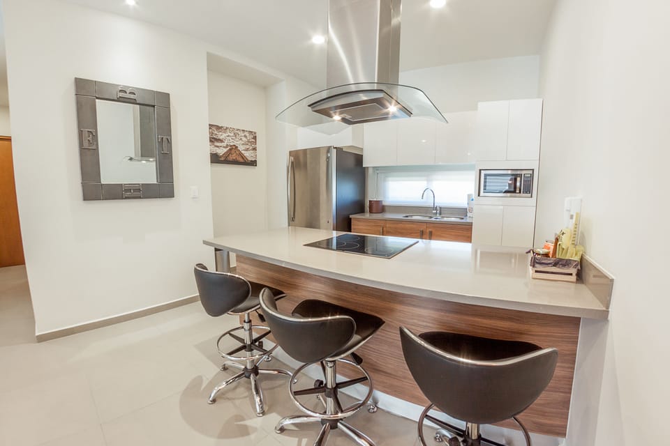 Chic Two Bedroom Penthouse | Private kitchen | Full-size fridge, microwave, oven, stovetop