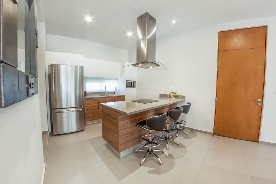 Chic Two Bedroom Penthouse | Private kitchen | Full-size fridge, microwave, oven, stovetop