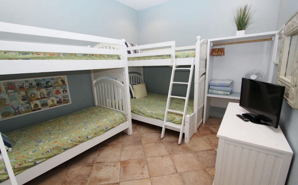 7th bedroom is a bunk room on 2nd floor with 3 Twins &1 Full