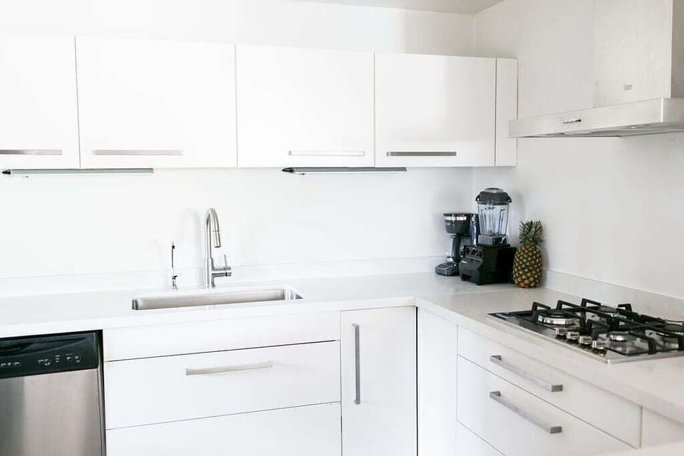 NEW DESIGNER KITCHEN WITH MODERN APPLIANCES, ALSO INCLUDES WASHER/DRYER