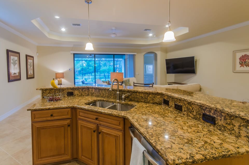Kitchen Bar sitting area with living room in back