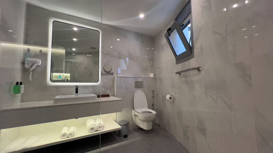 Double or Twin Room, Garden View | Bathroom | Shower, free toiletries, hair dryer, towels
