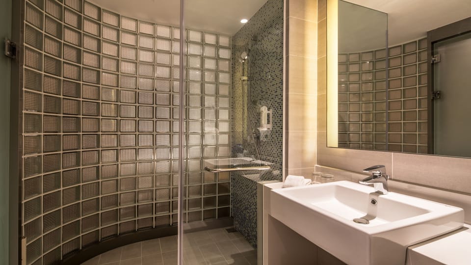 Shower, hair dryer, slippers, towels