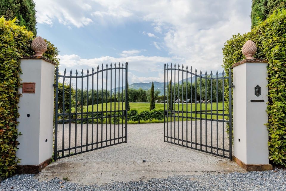 The gate the holiday villa and the garden all fenced.