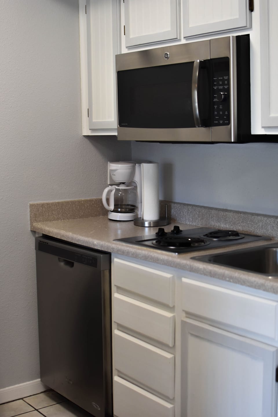 Dishwasher & Two burner stove. Microwave is a convection oven. Great for pizza!