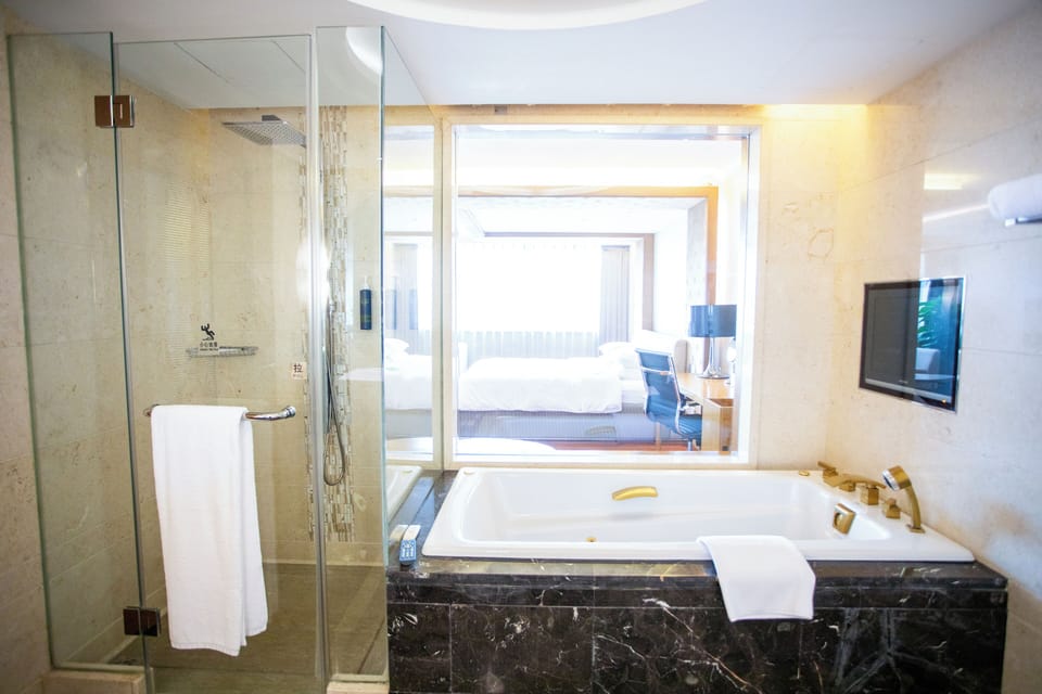 Separate tub and shower, hair dryer, bathrobes, slippers
