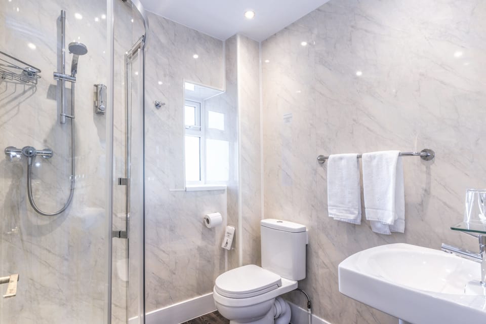 Shower, free toiletries, hair dryer, towels