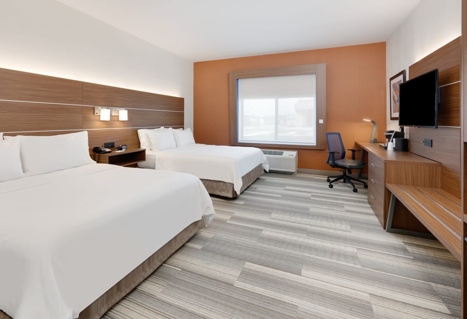 Tempur-Pedic beds, desk, laptop workspace, blackout drapes