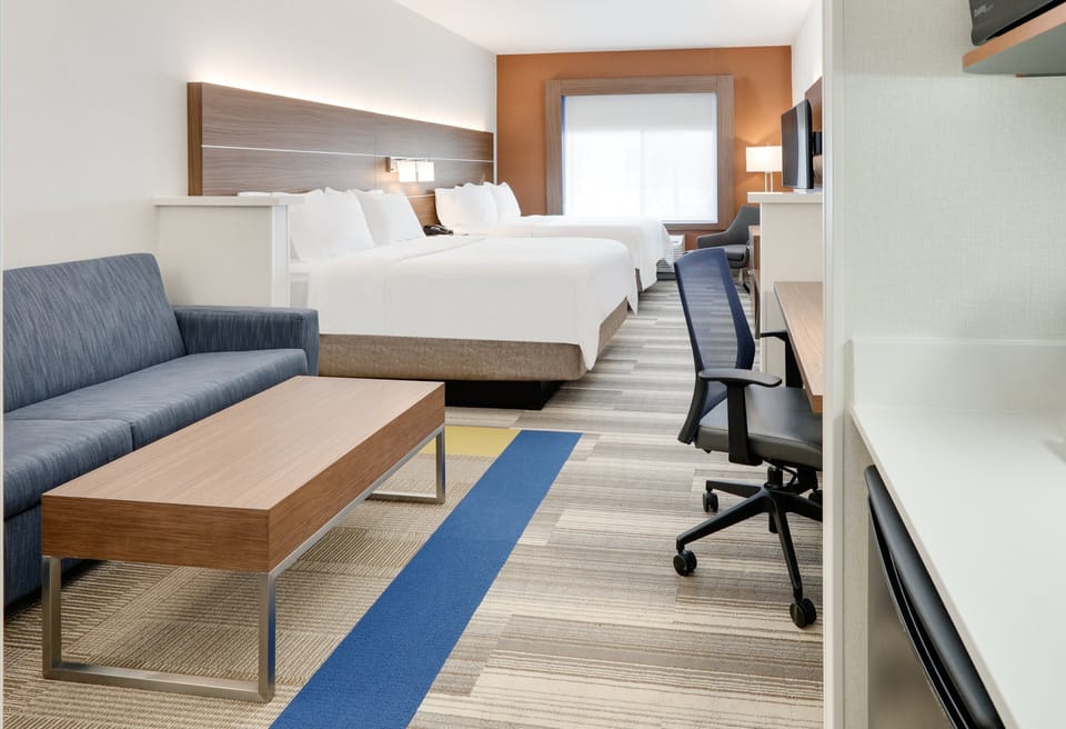 Tempur-Pedic beds, desk, laptop workspace, blackout drapes