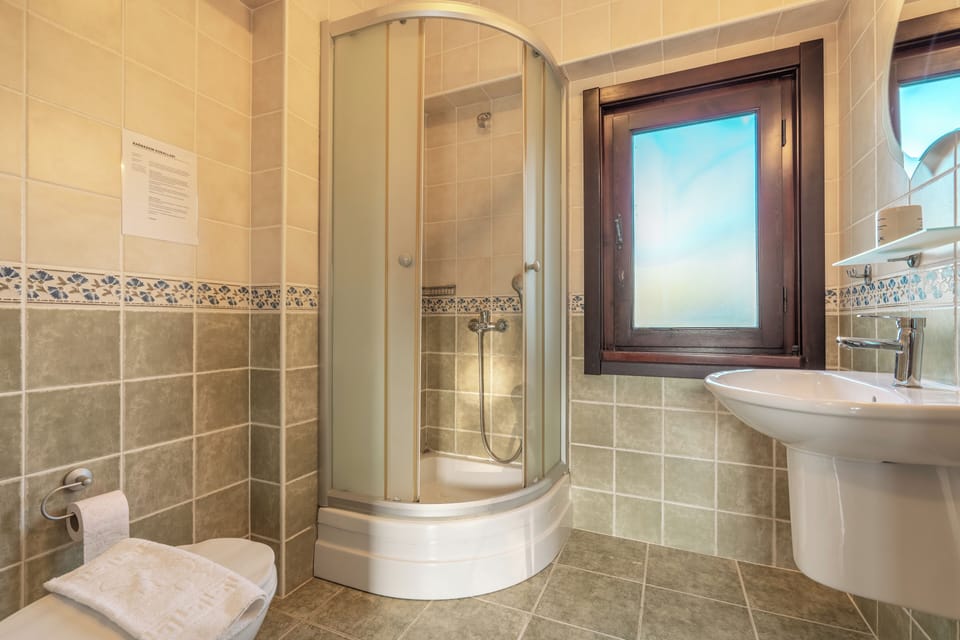 Deep soaking tub, hair dryer, slippers, towels