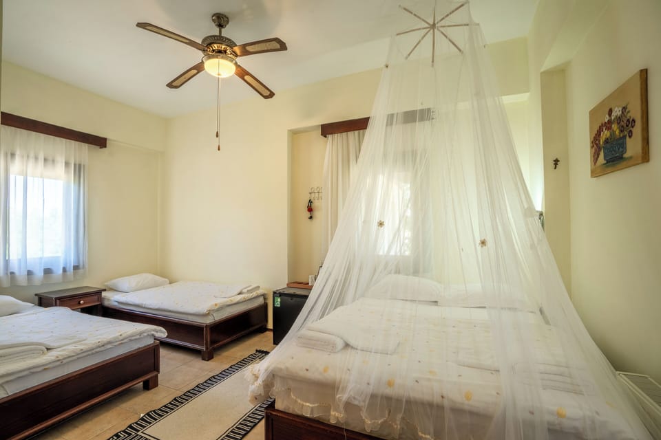 Family Quadruple Room | Hypo-allergenic bedding, desk, iron/ironing board, free WiFi