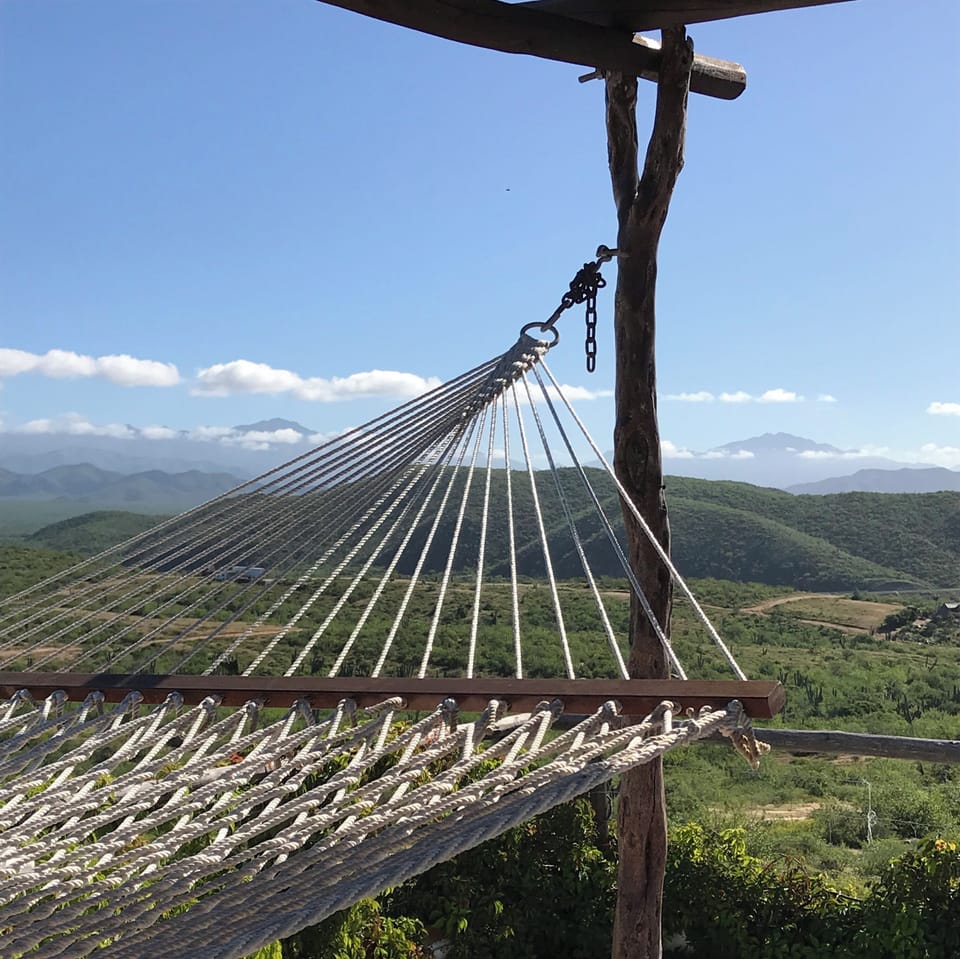 roof top hammock with mountain and ocean view