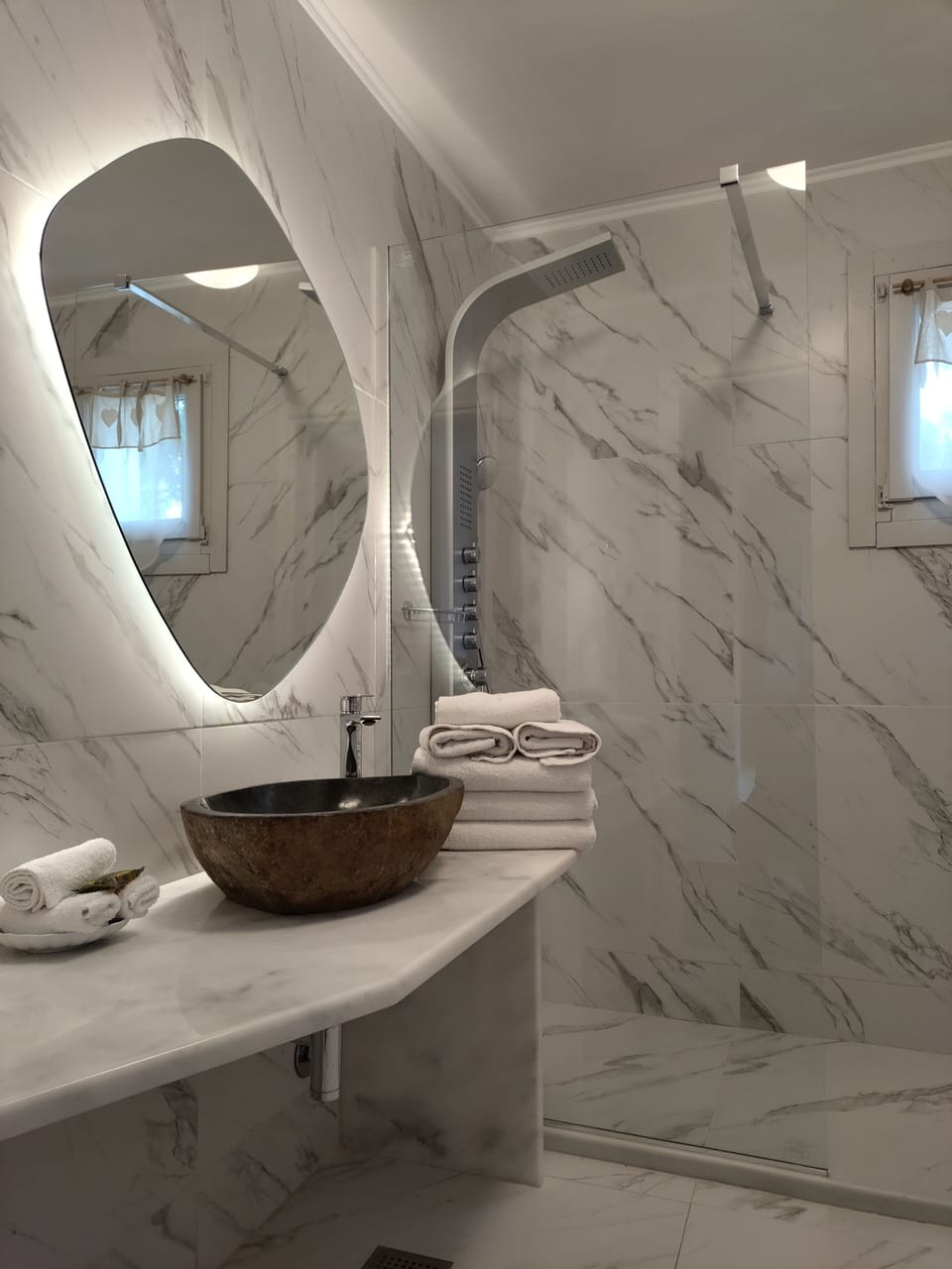 Designer toiletries, hair dryer, bathrobes, slippers