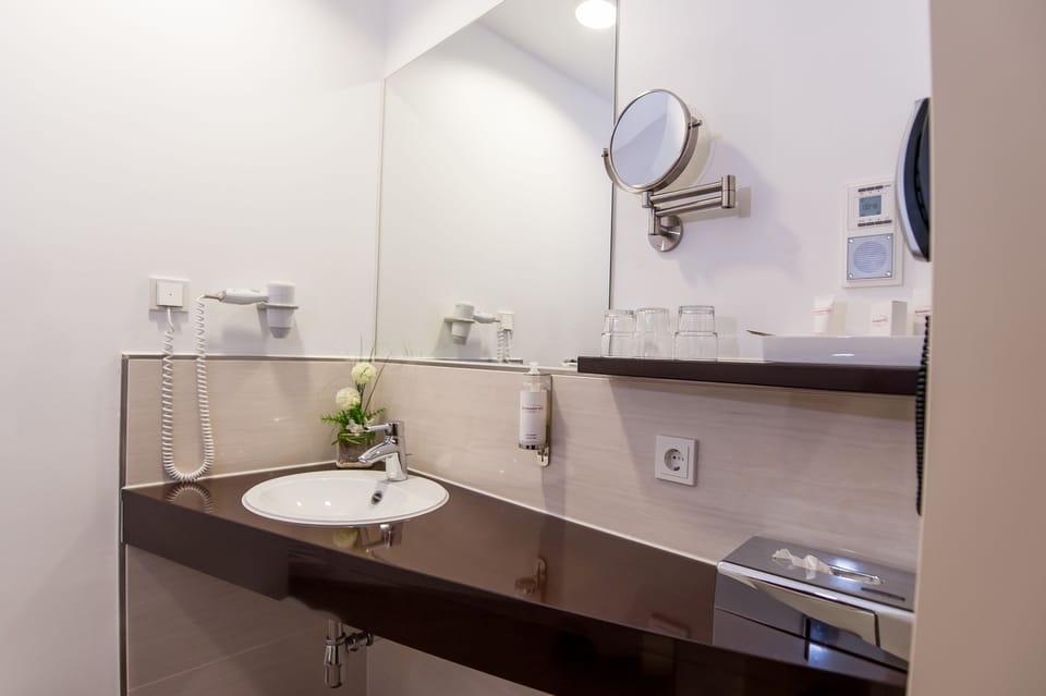 Shower, free toiletries, hair dryer, slippers