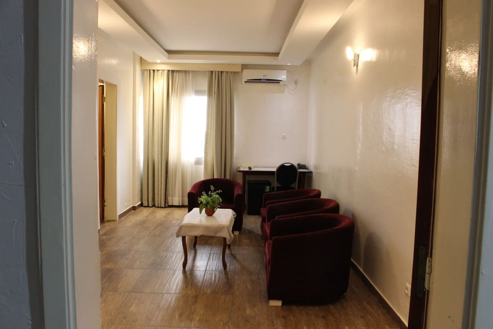 Deluxe Room | Living room | Flat-screen TV