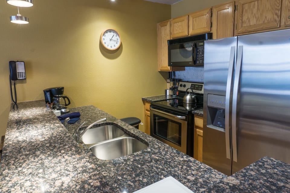Condo, 2 Bedrooms | Private kitchen | Full-size fridge, microwave, oven, stovetop
