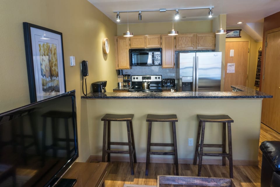 Condo, 2 Bedrooms | Private kitchen | Full-size fridge, microwave, oven, stovetop