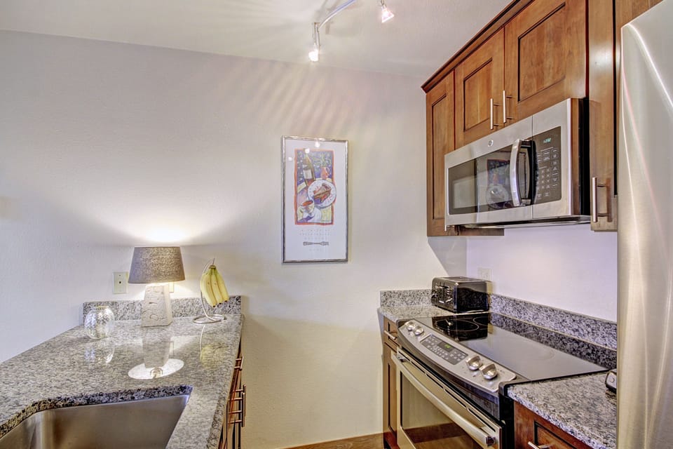 Condo, 2 Bedrooms | Private kitchen | Fridge, microwave, oven, dishwasher