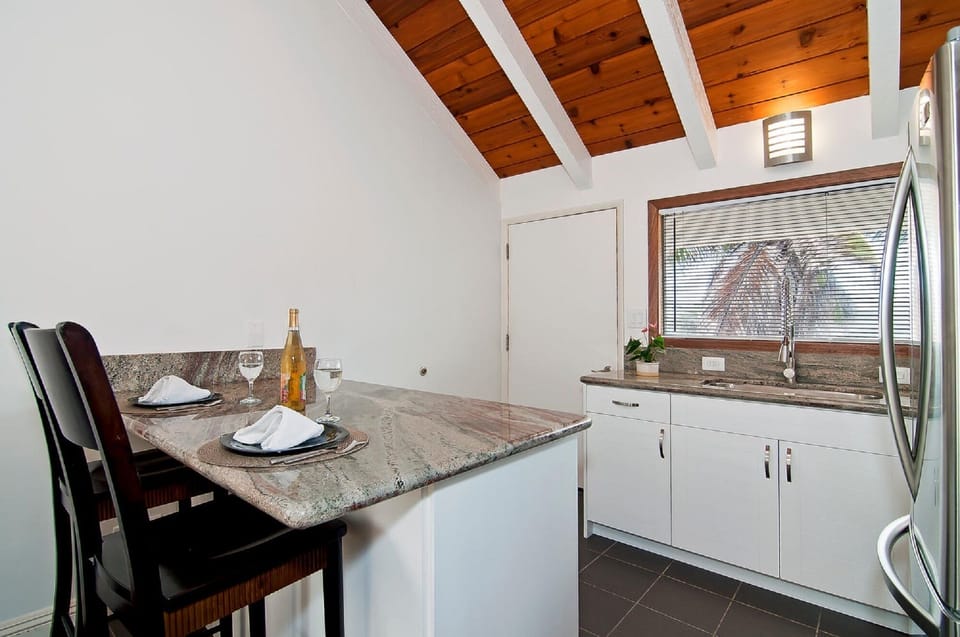 Kitchenette with island and granite countertops 