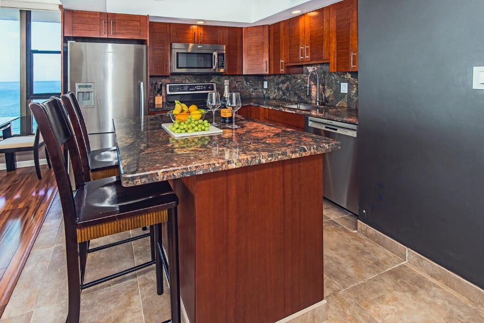 Kitchen Island-Caplavaro granite countertops. Asian Mahagony cabinets
