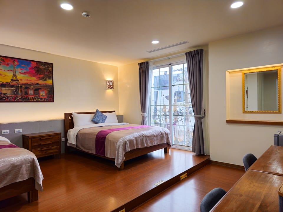 Family Quadruple Room | Down comforters, minibar, blackout drapes, soundproofing