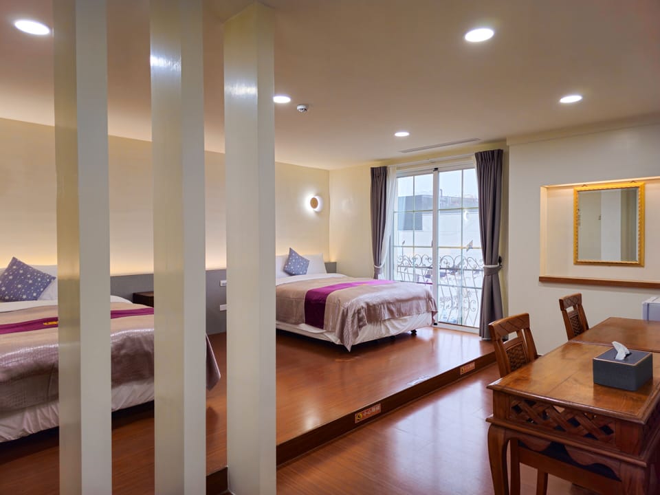 Family Quadruple Room | Down comforters, minibar, blackout drapes, soundproofing