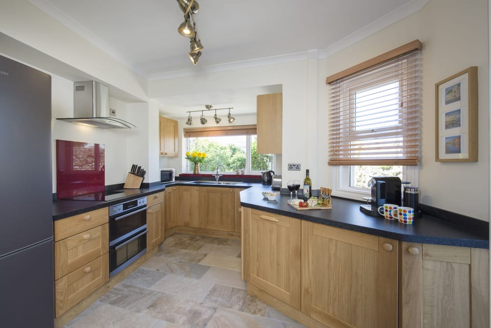 Oak kitchen overlooking the flint walled garden
