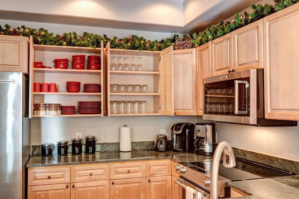 Fully Equipped Kitchen with matching flatware and glassware. No hodgepodge