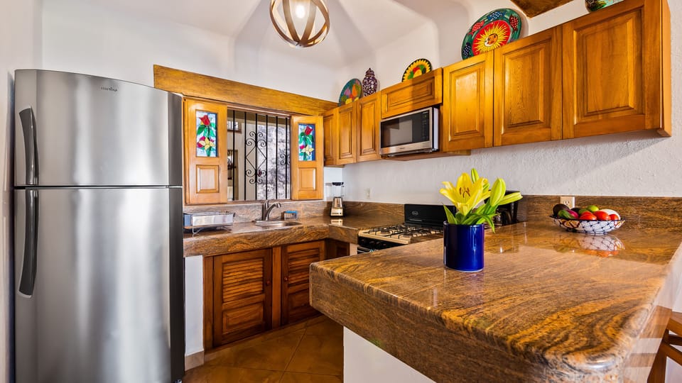 Fully Equipped Kitchen with brand new stainless steel fridge and microwave.