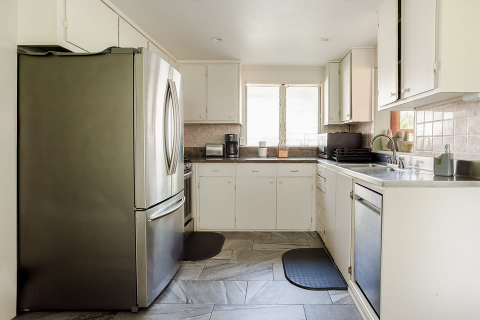 Downstairs kitchen with coffee maker, toaster, blender, microwave & dishwasher