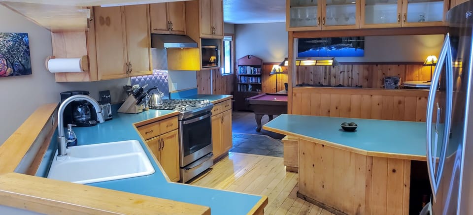 Dining Room Flows into Open Floor Plan Overlooks Forest, Mountains, & Valleys.