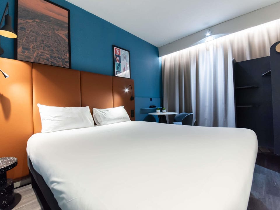 Premium bedding, desk, laptop workspace, soundproofing