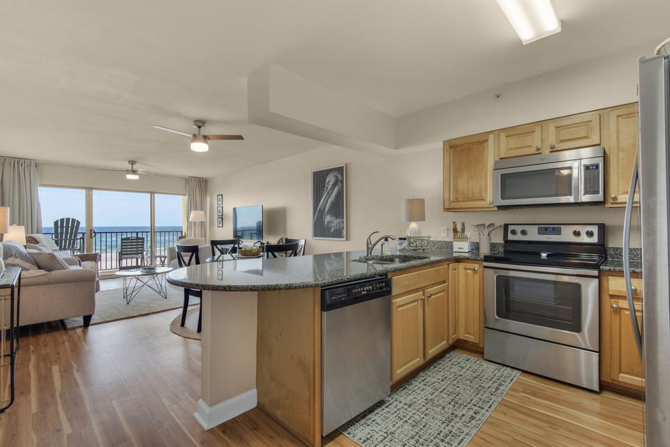 Kitchen looking out to the beach with both a traditional drip coffee maker and a  Keurig 