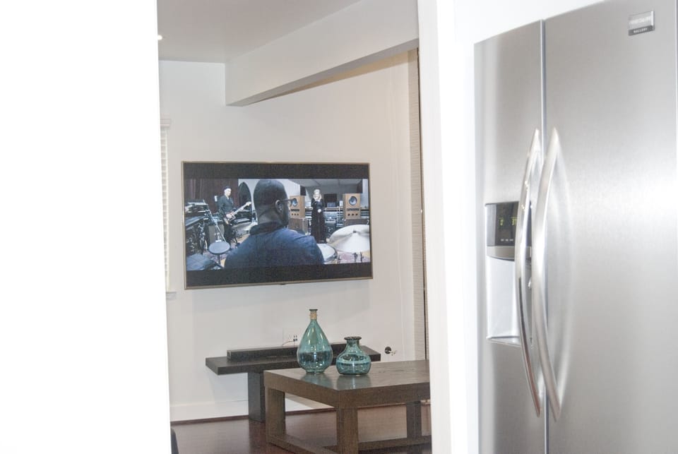 Watch the TV from the kitchen -  don't miss any of the action