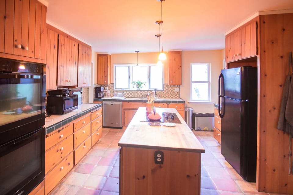 Main floor Chef's Kitchen with Double Oven; one of two full kitchens