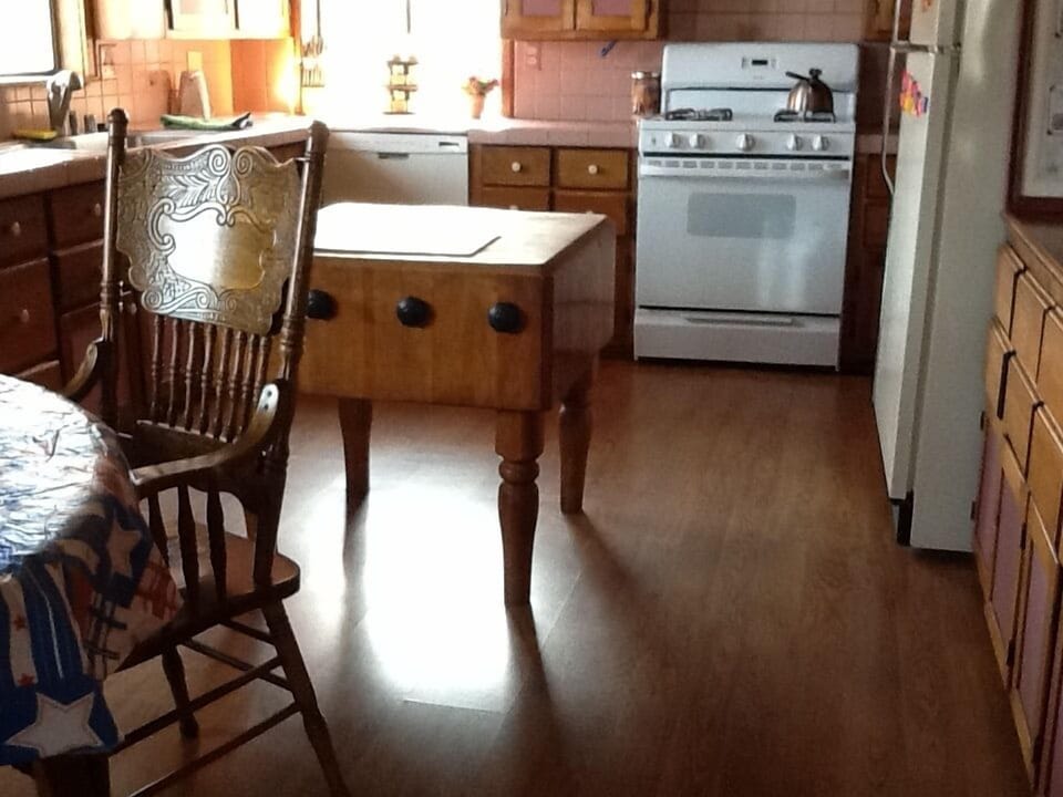 Large and spacious custom kitchen  with antique oak chopping block. 