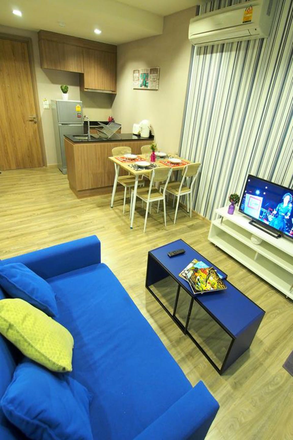 1-Bedroom Condo with Pool View  | Living room | Flat-screen TV