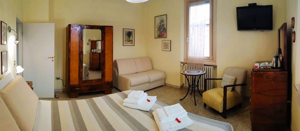 Family Triple Room | Minibar, in-room safe, blackout drapes, soundproofing