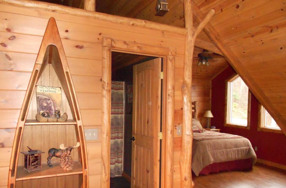 Queen loft bedroom right, shared full bath between. Bedroom has privacy curtain.