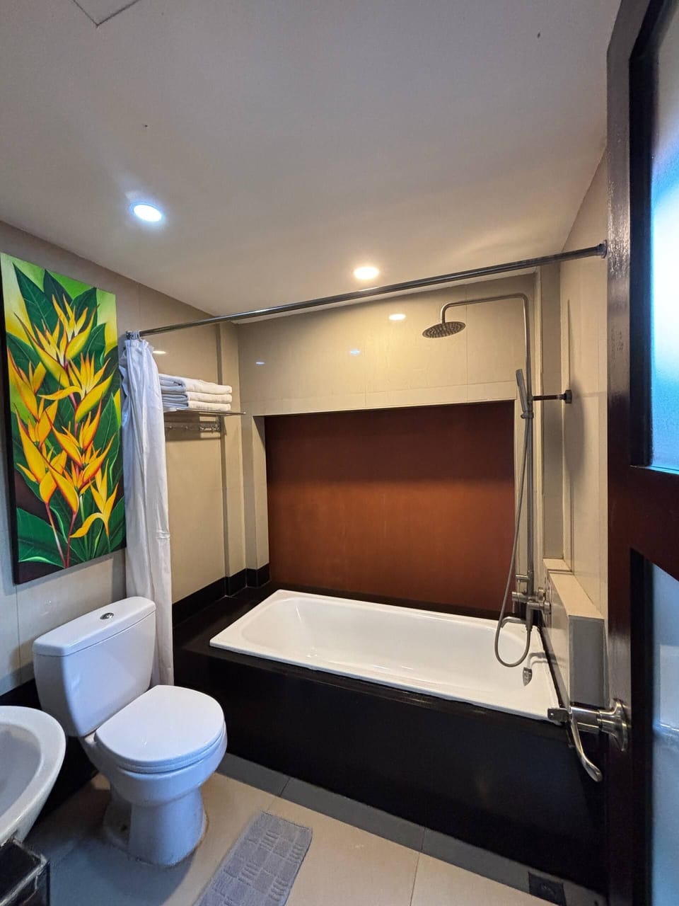 Separate tub and shower, free toiletries, slippers, towels