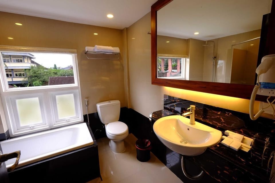 Superior Triple Room, 1 Bedroom, Smoking | Bathroom | Separate tub and shower, free toiletries, slippers, towels