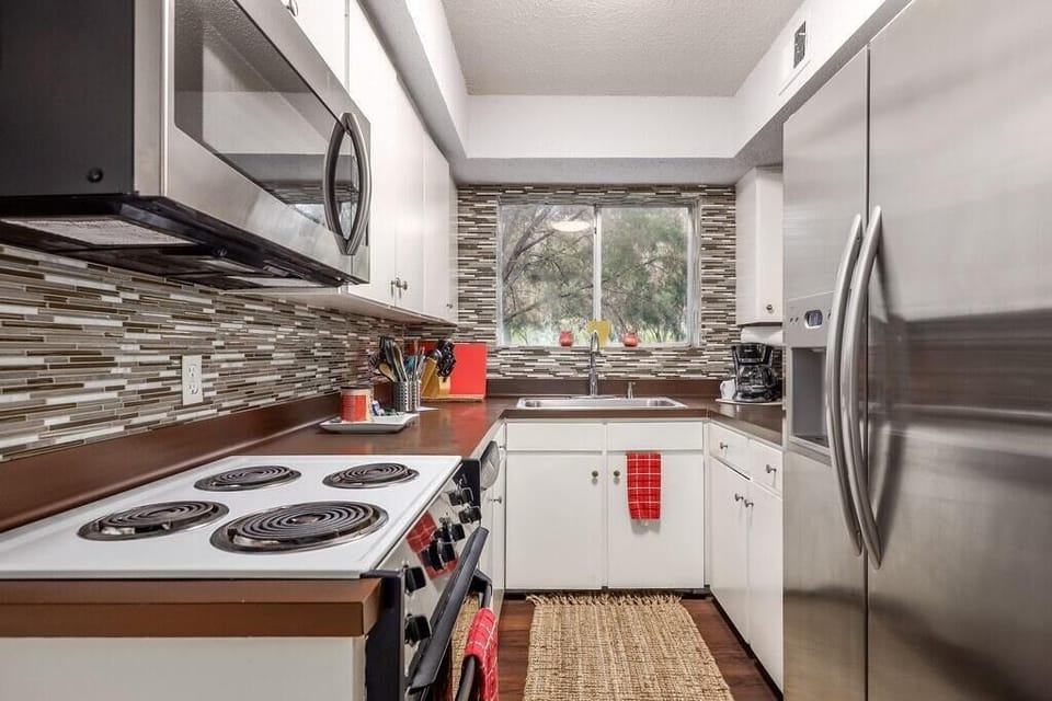 View of kitchen 
Stocked with essentials to cook and entertain. 
