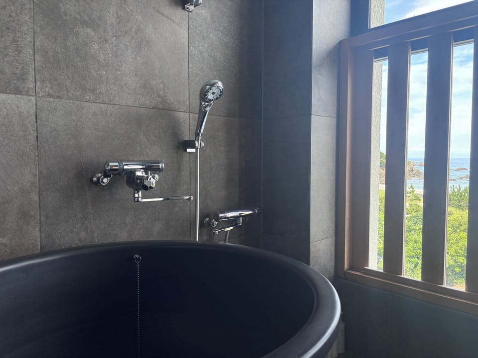 Japanese - Western Style Room with Open Air Bath, Non Smoking | Bathroom | Combined shower/tub, free toiletries, hair dryer, slippers
