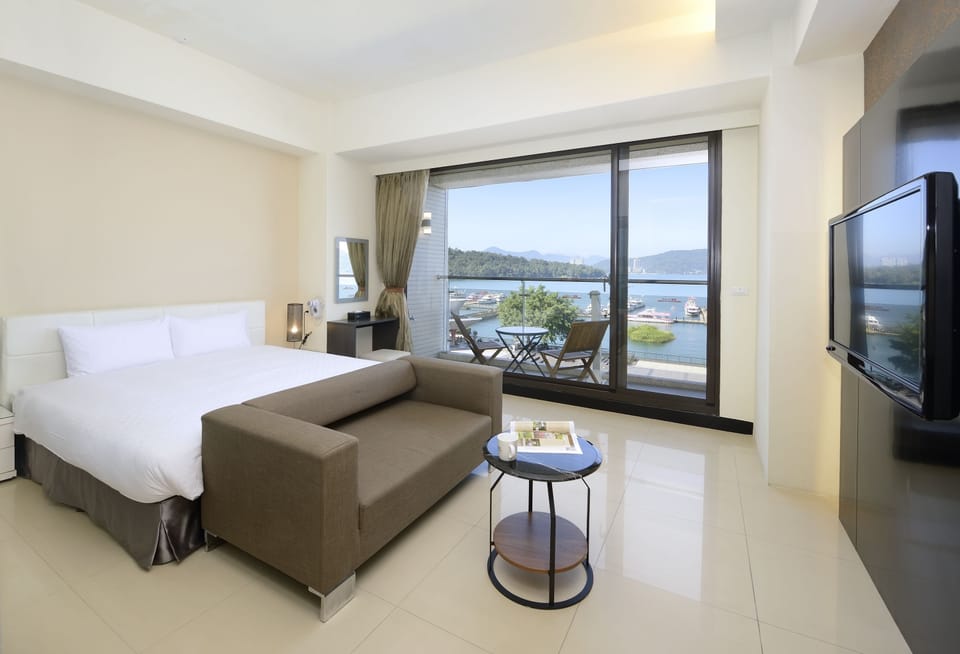 Panoramic Double Room, Lake View | Down comforters, desk, blackout drapes, soundproofing