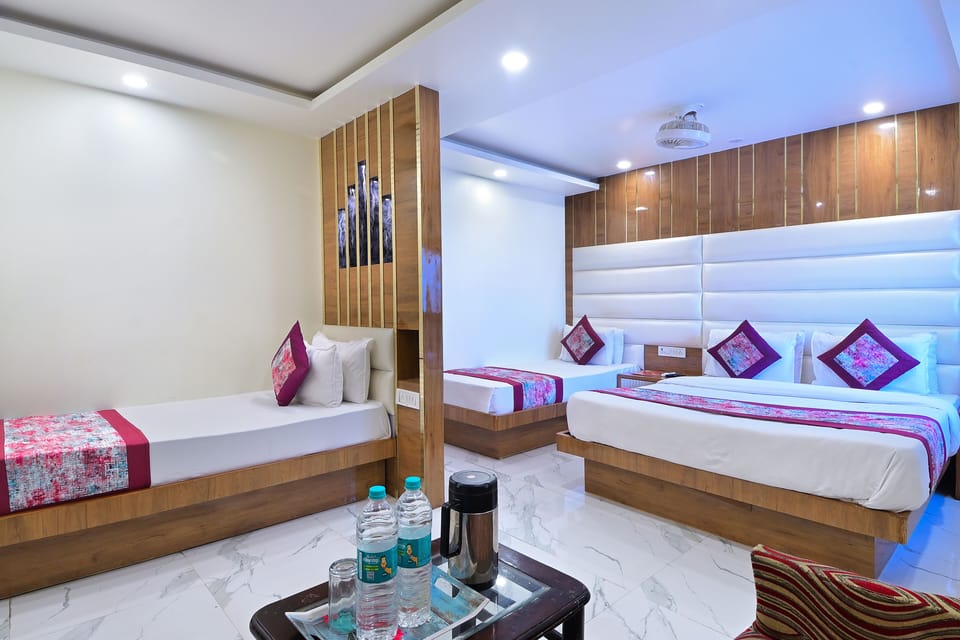 Deluxe Quadruple Room | Premium bedding, down comforters, memory foam beds, desk