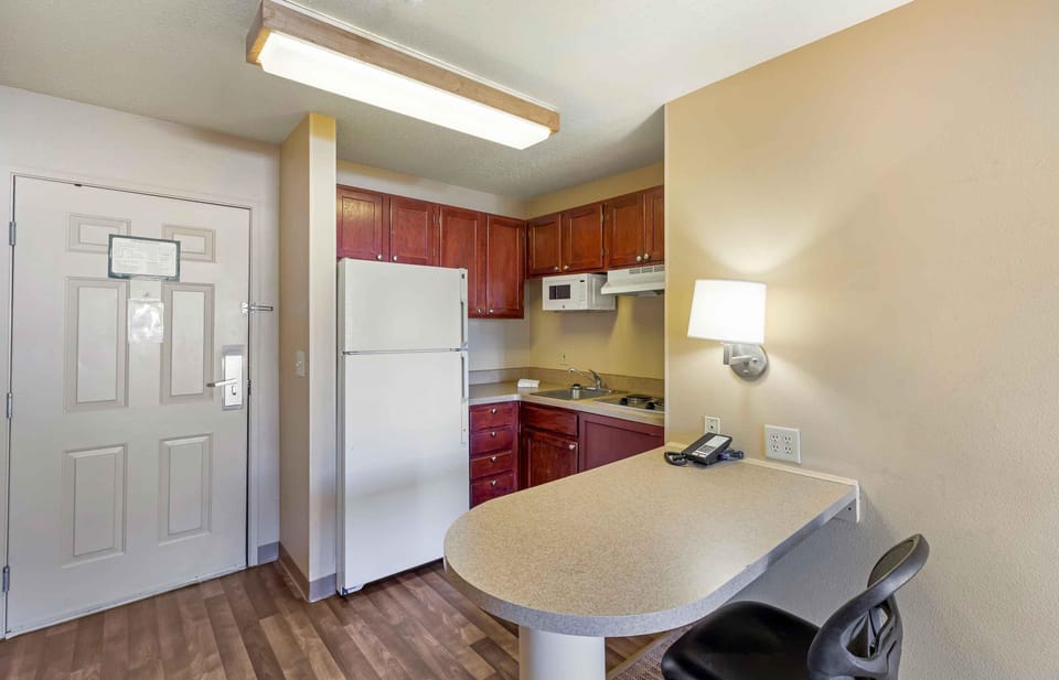 Deluxe Studio, 1 King Bed with Sofa bed, Non Smoking | Private kitchen | Full-size fridge, microwave, stovetop, dishwasher